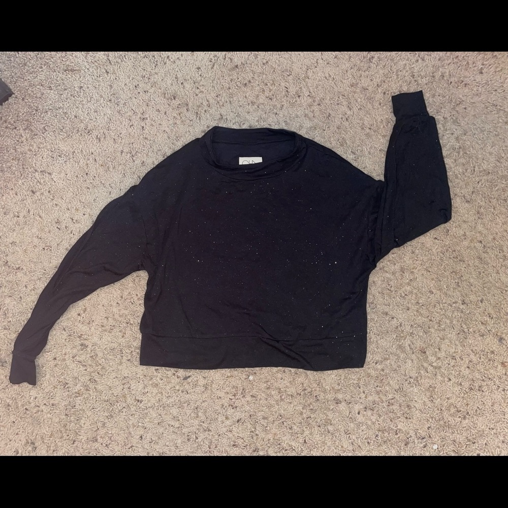 Sparkly black cropped long sleeve.